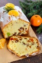 Christmas cake with nuts, dried fruit, tangerines.