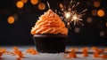 christmas cake with sparklers A festive photo of an orange cupcake with a sparkler on top.