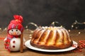 Christmas cake and toy smiling snowma Royalty Free Stock Photo
