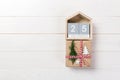 Christmas calendar 1 december. Christmas gift, fir branches on wooden white background. Copy space, top view