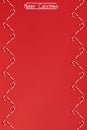 Christmas candies canes border on red background. Flat lay and top view Royalty Free Stock Photo