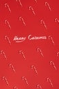 Christmas candies canes on red background. Flat lay and top view Royalty Free Stock Photo