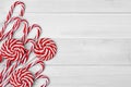 Christmas candies on white wooden background