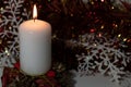 Christmas candle on black background. Royalty Free Stock Photo