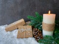 Christmas candle with handmade presents on snow. Royalty Free Stock Photo