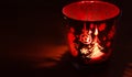 Christmas candle holders glowing red. Royalty Free Stock Photo