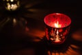 Christmas candle holders glowing red. Royalty Free Stock Photo