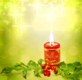 Christmas candle and holly background Royalty Free Stock Photo