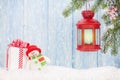 Christmas candle lantern, gift box and snowman Royalty Free Stock Photo