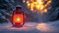 Christmas candle lantern in snow against blurred background. Selective focus and shallow depth of field Royalty Free Stock Photo