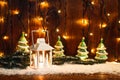 Christmas candle lantern and Christmas tree branches, snow, snowflake and decorations on bokeh background blurred lig Royalty Free Stock Photo