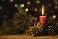 Christmas candle with statuette of baby Jesus Royalty Free Stock Photo