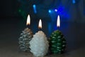 Christmas candles on a blurred background of garland lights Royalty Free Stock Photo
