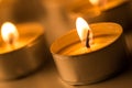 Christmas candles burning at night. Abstract candles background. Golden light of candle flame. Royalty Free Stock Photo