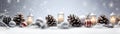 Christmas candles burning, red and silver balls and pine cones in a row. Royalty Free Stock Photo