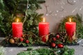 Christmas candles with fir-tree branches Royalty Free Stock Photo