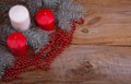 Christmas candles on the old wooden background Royalty Free Stock Photo