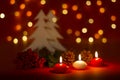Christmas candles and ornaments over dark background with lights Royalty Free Stock Photo