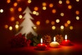 Christmas candles and ornaments over dark background with lights Royalty Free Stock Photo