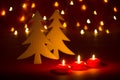 Christmas candles and ornaments over dark background with shaped bokeh lights Royalty Free Stock Photo