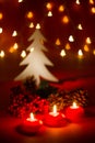 Christmas candles and ornaments over dark background with shaped bokeh lights Royalty Free Stock Photo