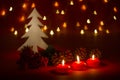 Christmas candles and ornaments over dark background with shaped Royalty Free Stock Photo