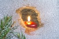 Christmas candles on a snowy window Royalty Free Stock Photo