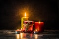 Christmas candles on wooden table and black background Royalty Free Stock Photo