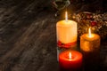 Christmas candles on wooden table. Royalty Free Stock Photo