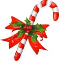 Christmas candy cane decorated with a bow and holl Royalty Free Stock Photo