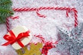 Christmas candy cane frame on snow Royalty Free Stock Photo