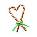 Christmas candy cane heart isolated on white. New Year Christmas decoration candy canes ribbon with bow Royalty Free Stock Photo