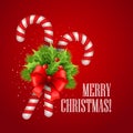 Christmas candy cane with holly and red bow Royalty Free Stock Photo