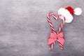 Christmas candy canes, stick and decor on color background. Christmas candy cane heart on an red background Royalty Free Stock Photo