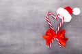 Christmas candy canes, stick and decor on color background. Christmas candy cane heart on an red background Royalty Free Stock Photo