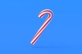 Christmas cane, candy with red stripes on blue background