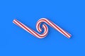 Christmas canes, candy with red stripes on blue background