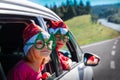 Christmas car travel- happy boy and girl travel in winter Royalty Free Stock Photo