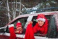 Christmas car travel- happy kids travel in winter with presents Royalty Free Stock Photo
