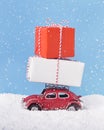 Christmas car Volkswagen Beetle with present boxes over background Royalty Free Stock Photo