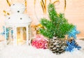 Christmas background with candlelight and fir tree under snowfall Royalty Free Stock Photo