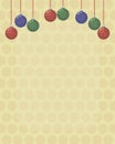 Christmas card background with colored red, green and blue glass Christmas-tree balls on red long threads on a light yellow Royalty Free Stock Photo