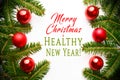 Festive background made of Christmas decorations with message `Merry Christmas & HEALTHY NEW YEAR`