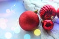 Christmas card. Beautiful Christmas background. Lots of red balls big and small on blue texture background. White snowflakes circl Royalty Free Stock Photo