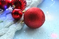 Christmas card. Beautiful Christmas background. Lots of red balls big and small on blue texture background. White snowflakes circl Royalty Free Stock Photo