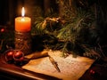 Christmas card, burning candle, open vintage book with pen