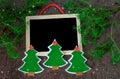 Christmas card. christmas decoration handed christmas trees from felt with red stars, shining stars and black chalkboard