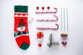 Christmas card concept with sock, candy and new year decorations toys on white background Royalty Free Stock Photo