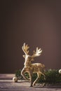Christmas card conception. Christmas toy deer decoration with christmas tree branch and snow Royalty Free Stock Photo