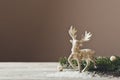 Christmas card conception. Christmas toy deer decoration with christmas tree branch and snow Royalty Free Stock Photo